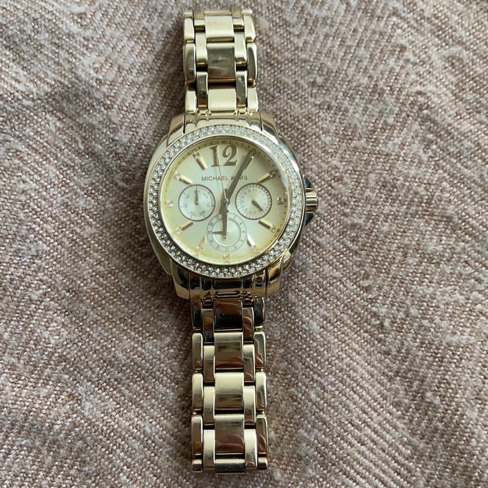 Michael Kors gold watch.